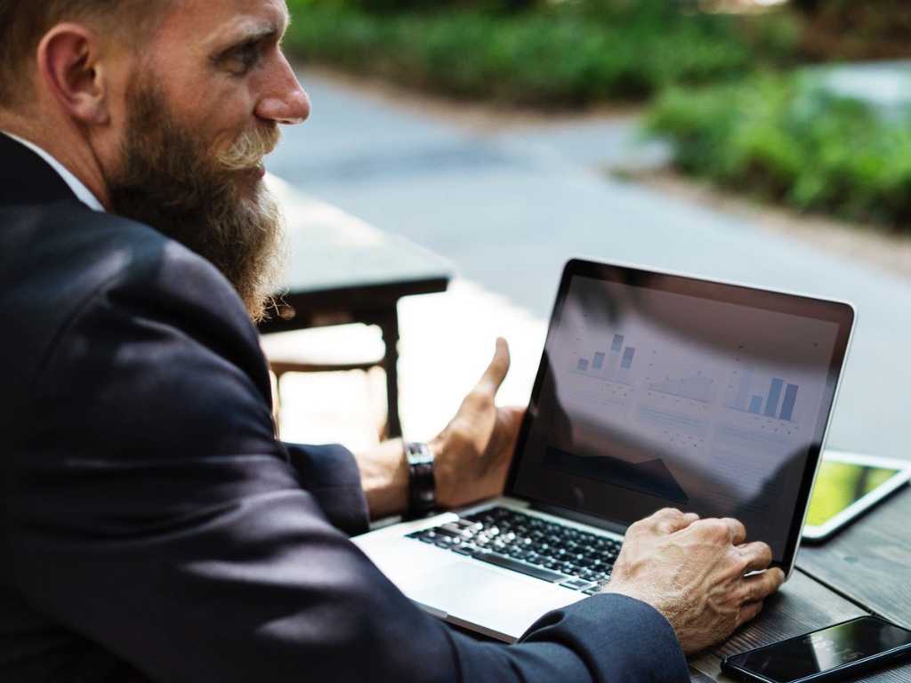 Man Outside Working on Laptop