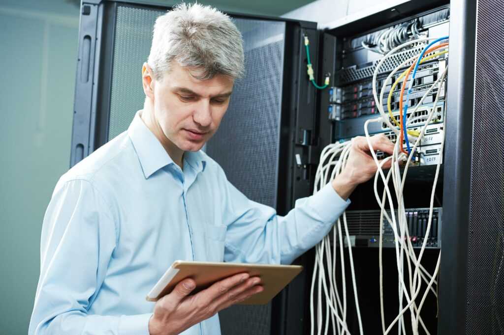 IT Manager Working on a Server - Questions to Ask When Hiring an IT Manager