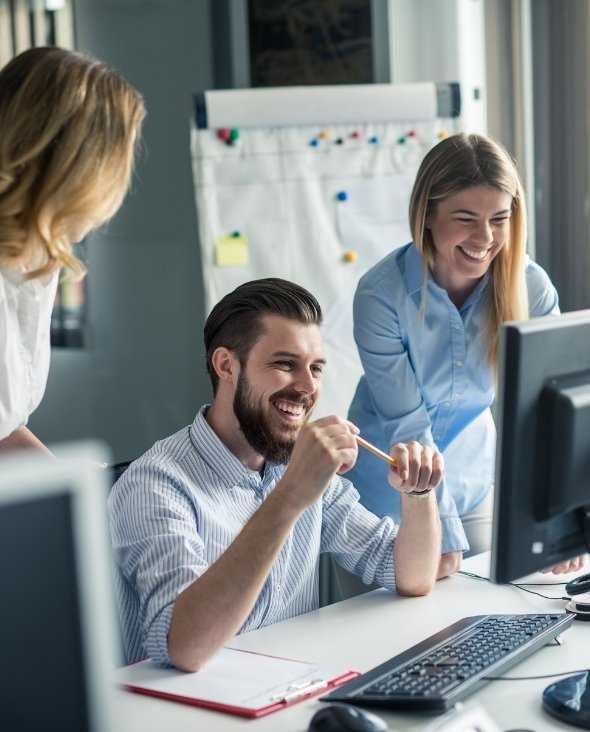 Business Professionals Working Together On Computer