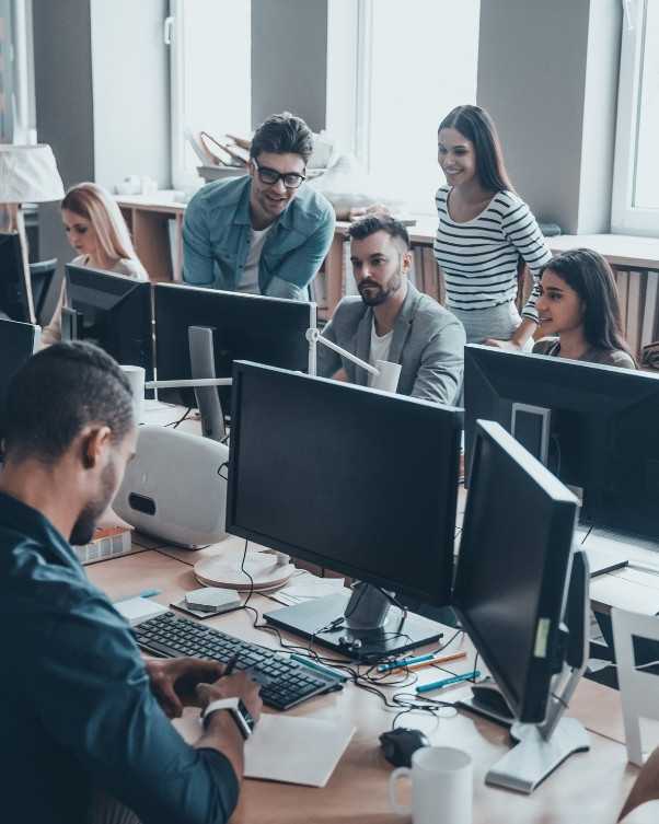IT Professionals Working In Office With Computers