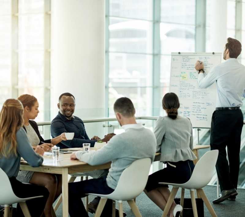 Business Professionals In Meeting Room Discussion