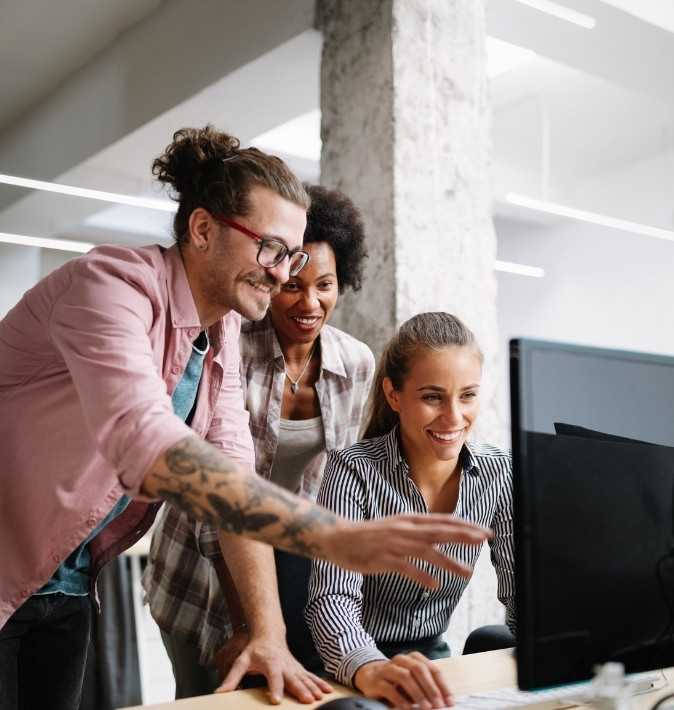 Business Professionals Collaborating On Computer