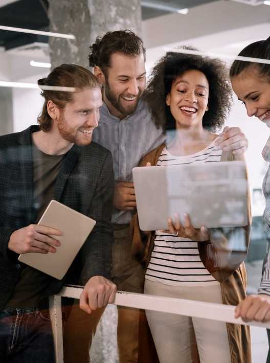 Business Professionals Discussing Ideas With Laptop