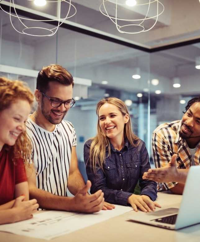 Business Professionals Smiling During Meeting