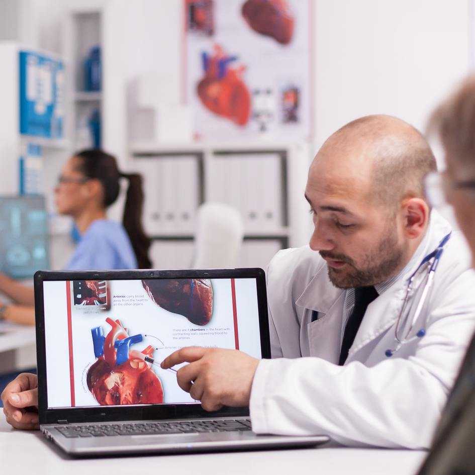  Doctor Explaining Heart Anatomy on Laptop