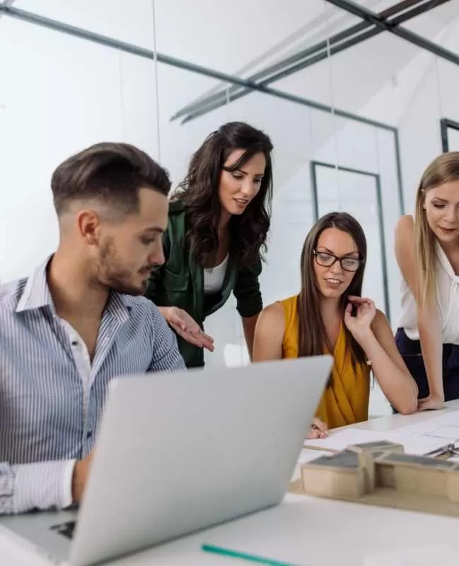 Team of Professionals working on a Laptop