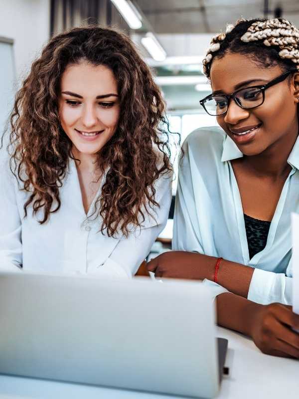 Two Womens Working on a Laptop