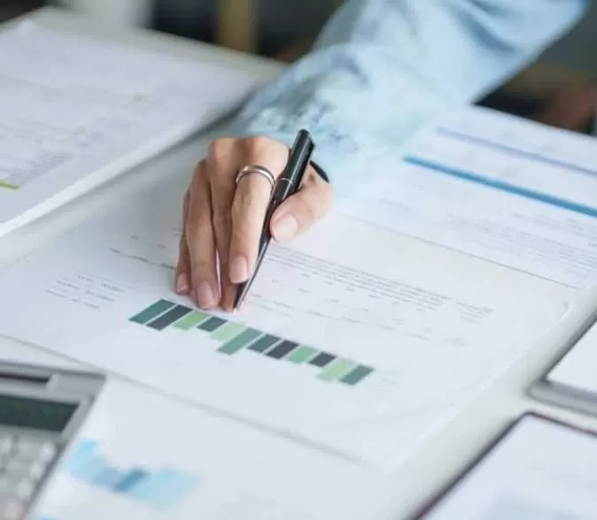 IT Analyst Reviewing Data Charts And Reports<br />

