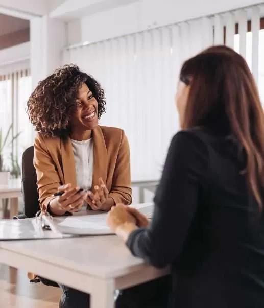 IT Professionals Having A Discussion In Office<br />
