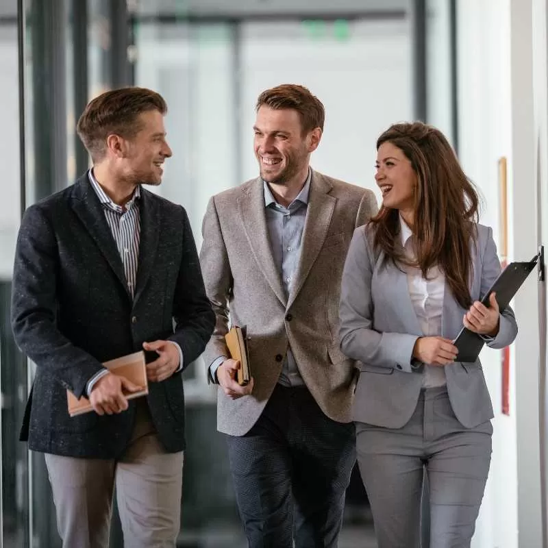 IT Professionals Walking In Office Hallway<br />
