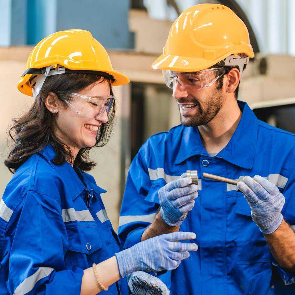  Engineers Discussing In Industrial Workshop