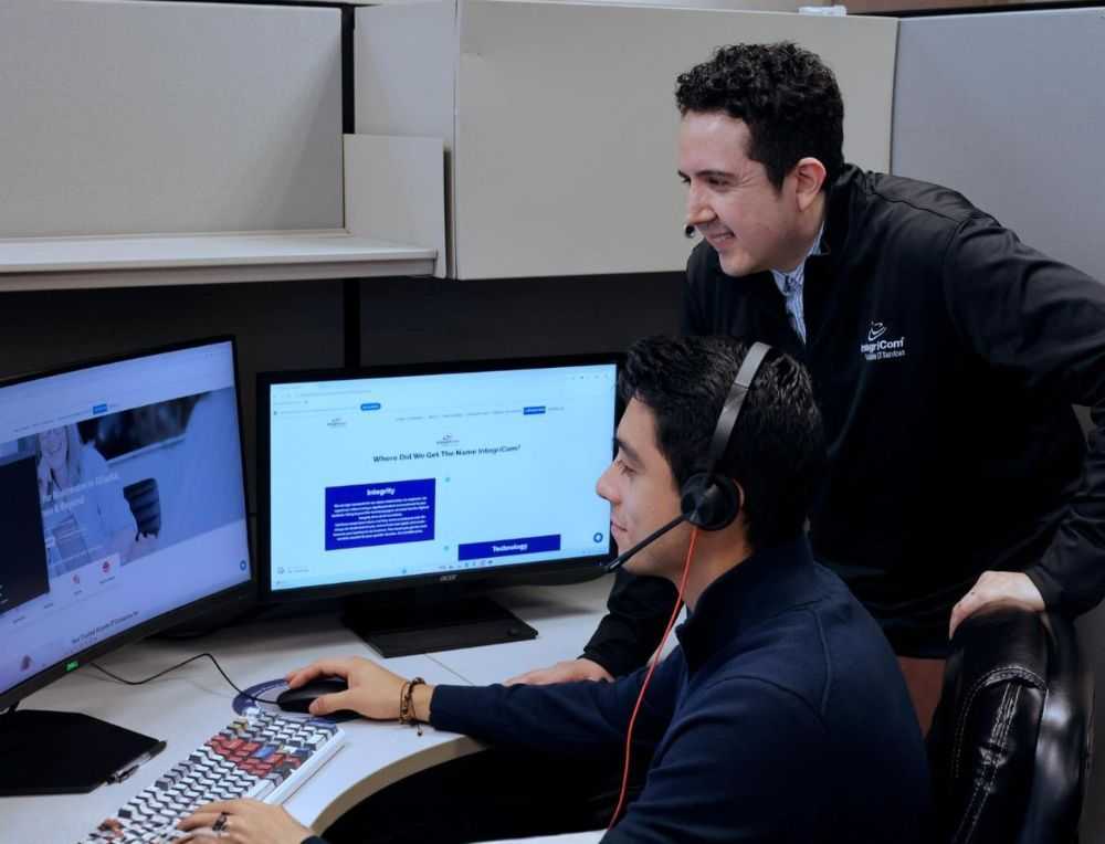 Business Team Meeting In Conference Room With Laptops And Charts