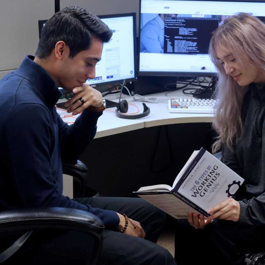 IT Team Working on Computers in Modern Office<br />
