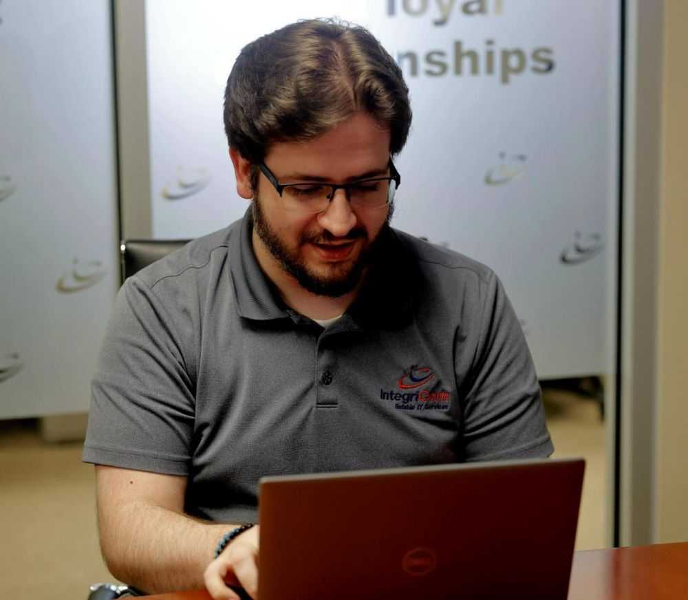 IT Professionals Walking In Office Hallway<br />
