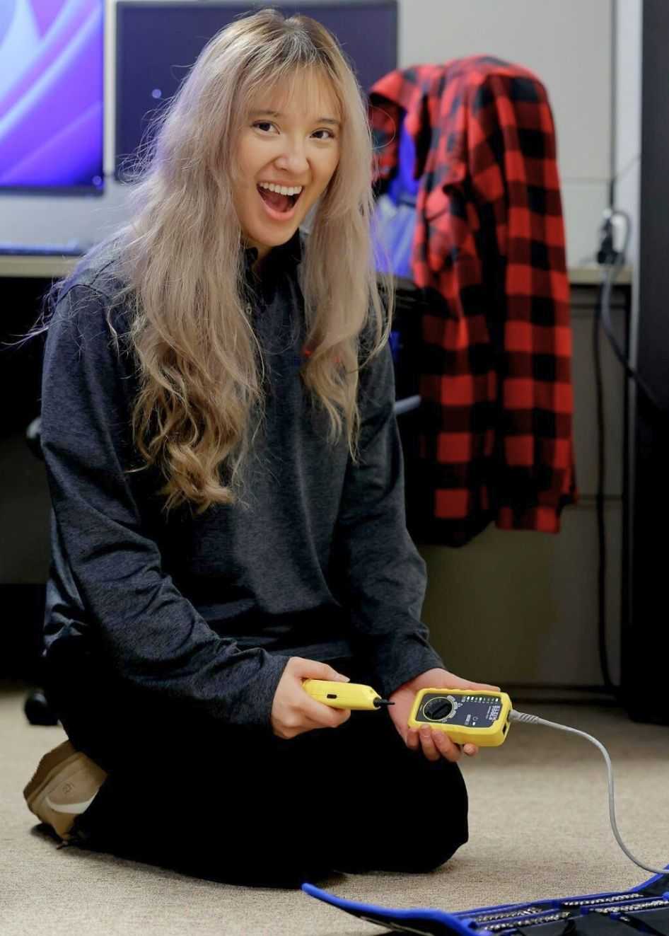 Three professionals working on laptops in a  office