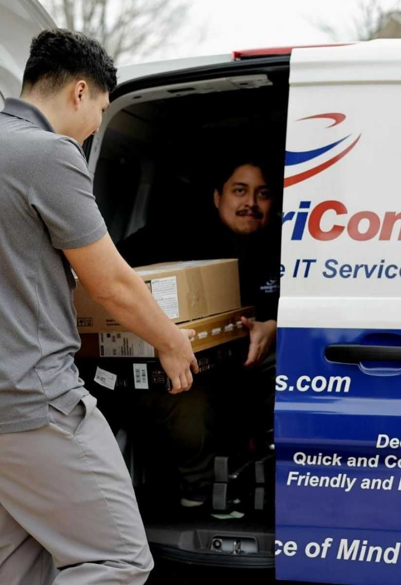 Business Professionals In Meeting With Laptops