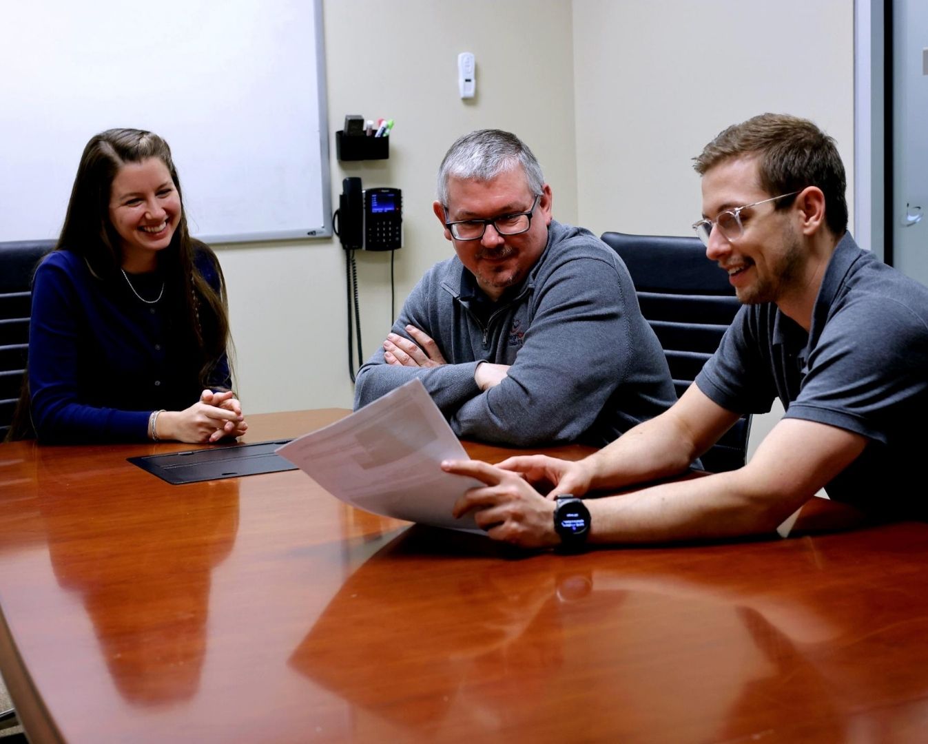  IntegriCom Team Members Discussing<br />
