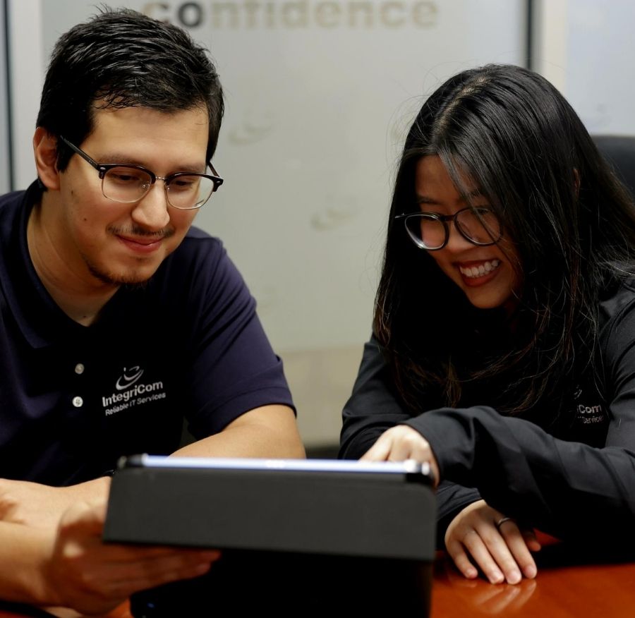 It Team Collaborating At Desk